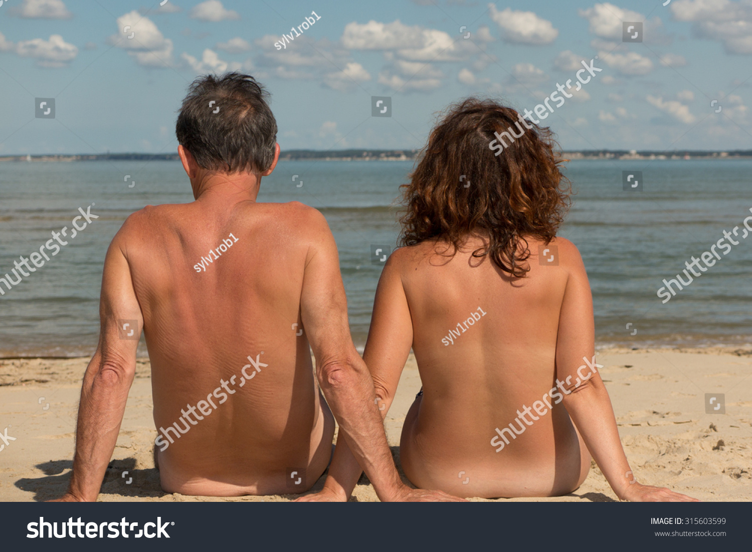 craig ahearn add naked couples on the beach photo